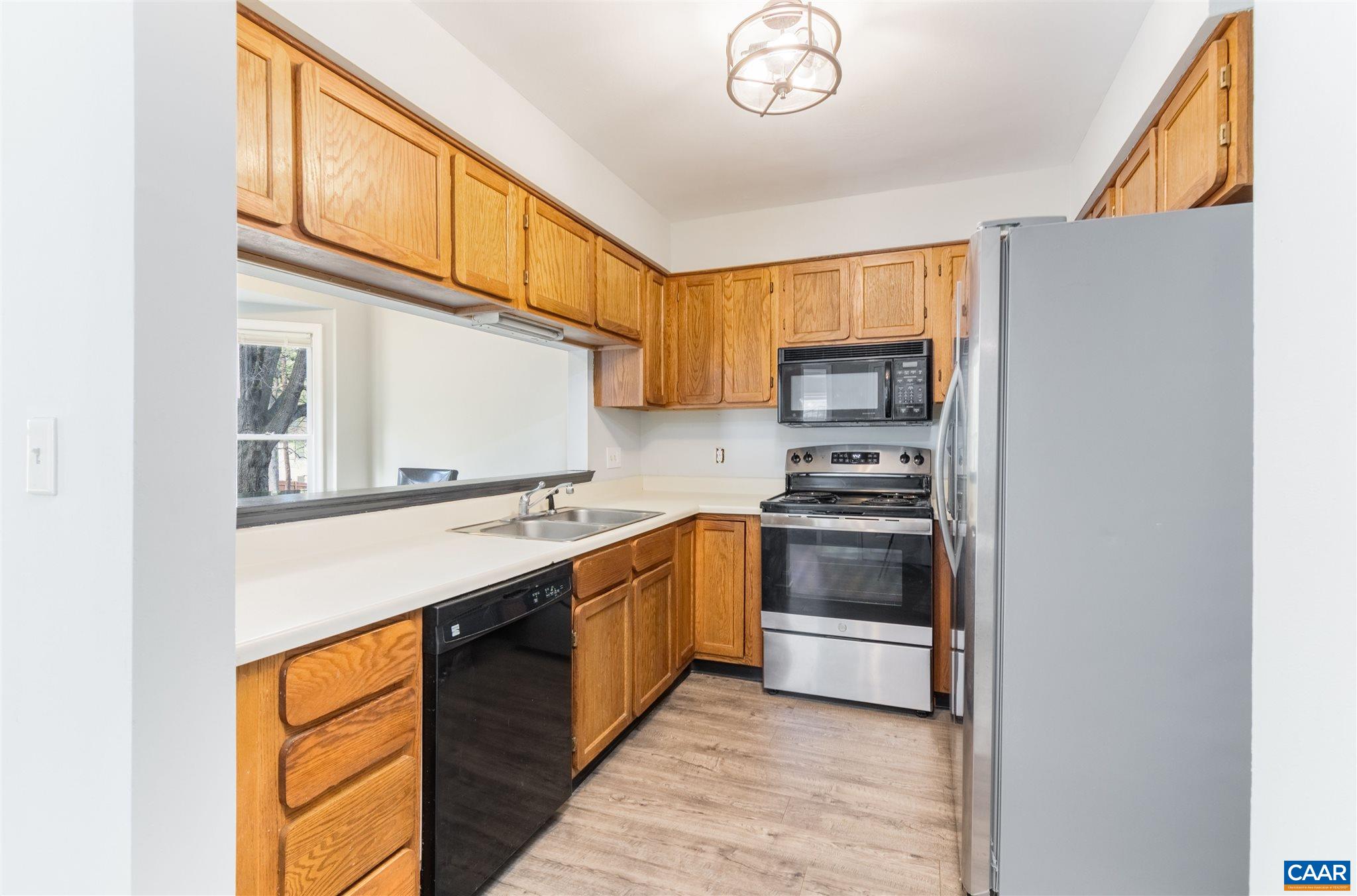 342 Westfield Road Charlottesville, VA 22901 - Photo 14 of 23 a kitchen with stainless steel appliances granite countertop a stove and a refrigerator