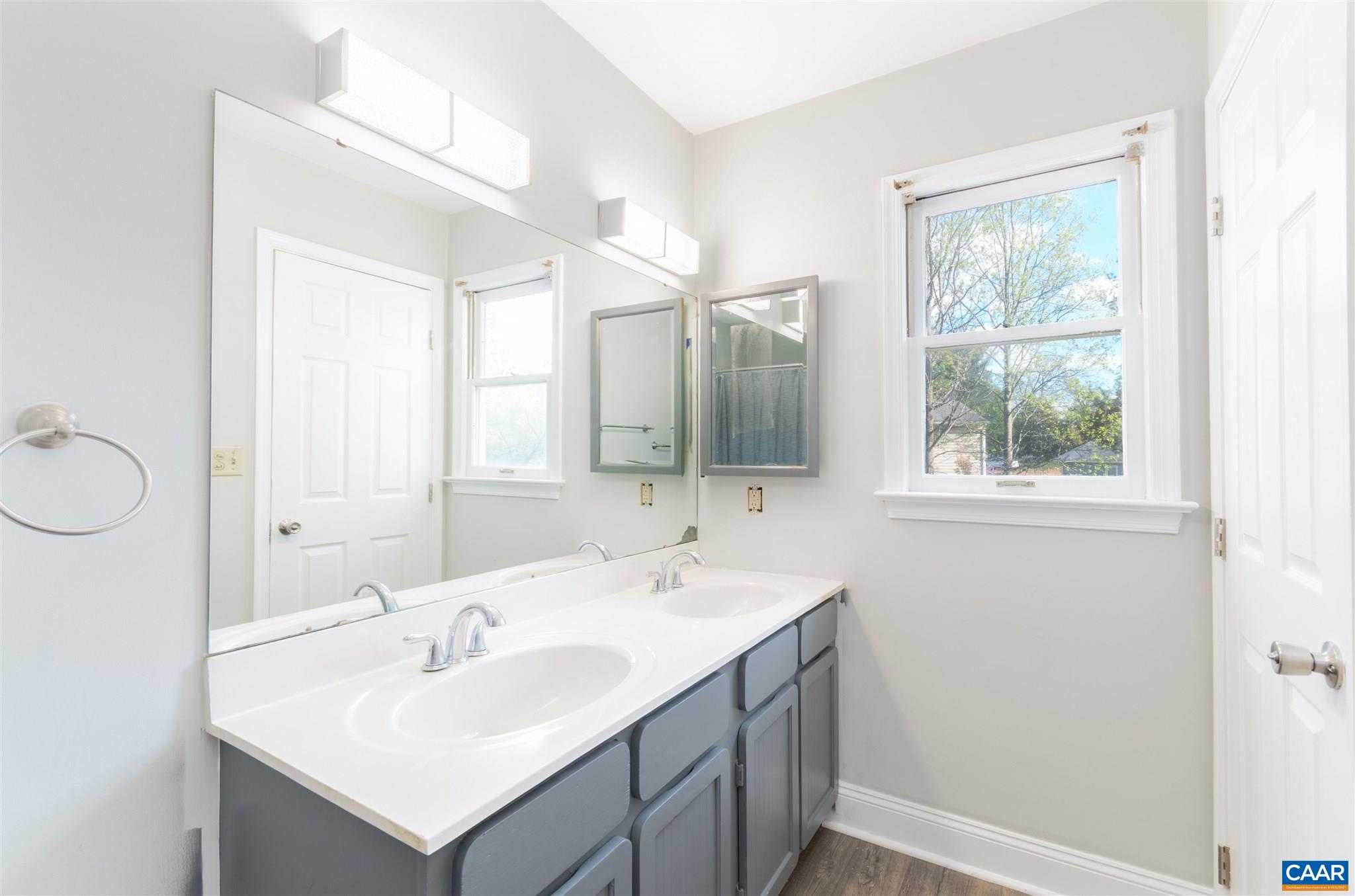 342 Westfield Road Charlottesville, VA 22901 - Photo 3 of 23 a bathroom with a sink mirror and a window