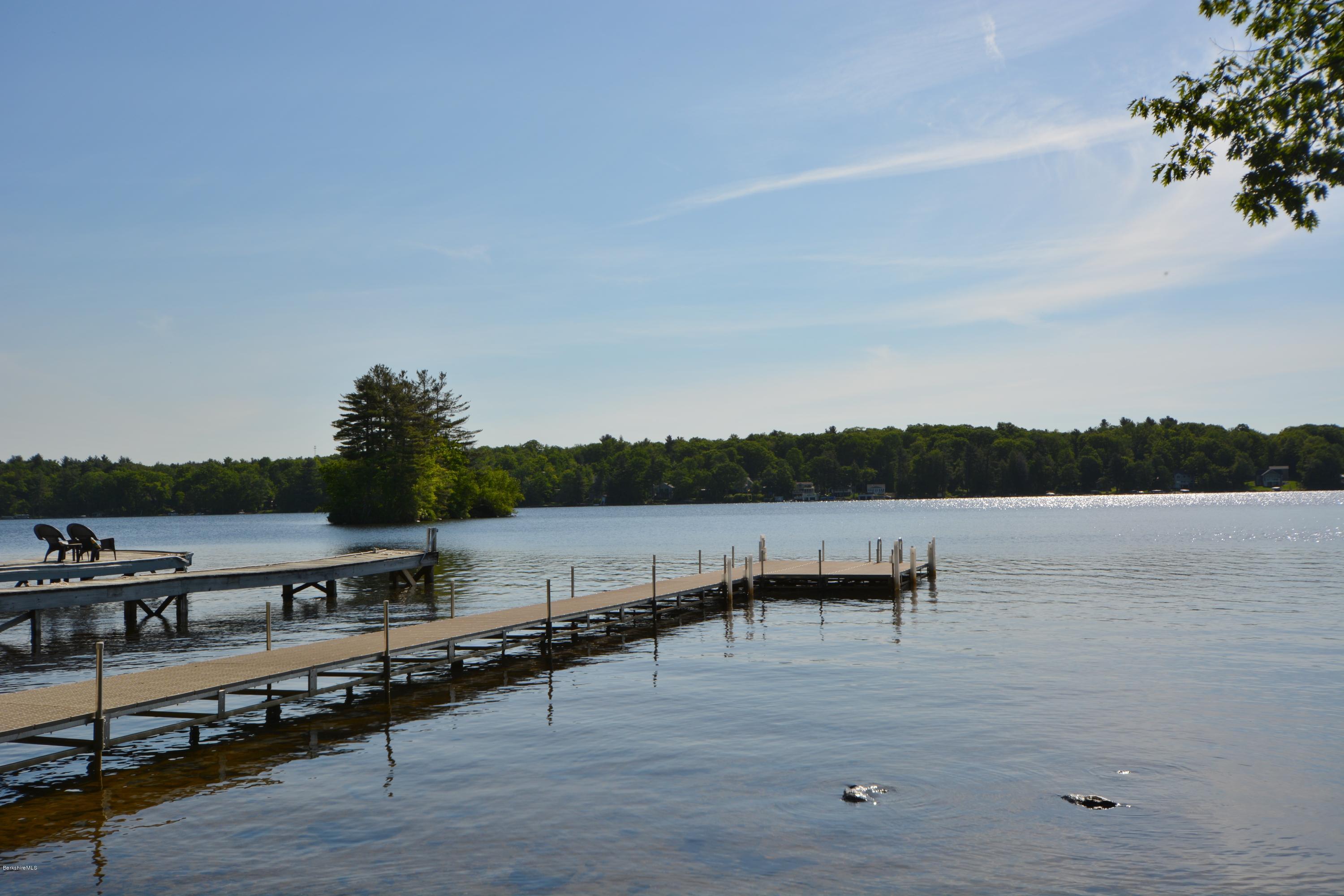 9 Old Stagecoach Road Otis, MA 01029 - Photo 2 of 17 a view of a lake with outdoor seating