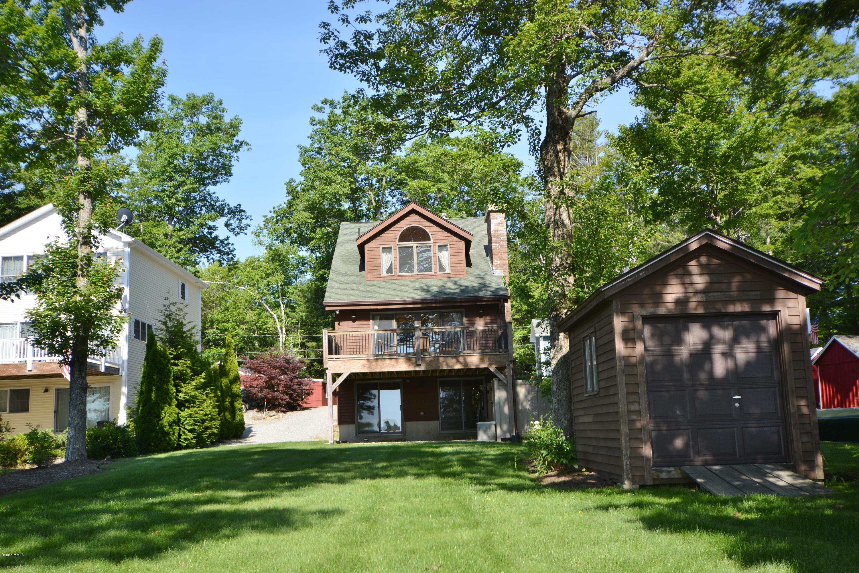 9 Old Stagecoach Road Otis, MA 01029 - Photo 3 of 17 a front view of a house with garden