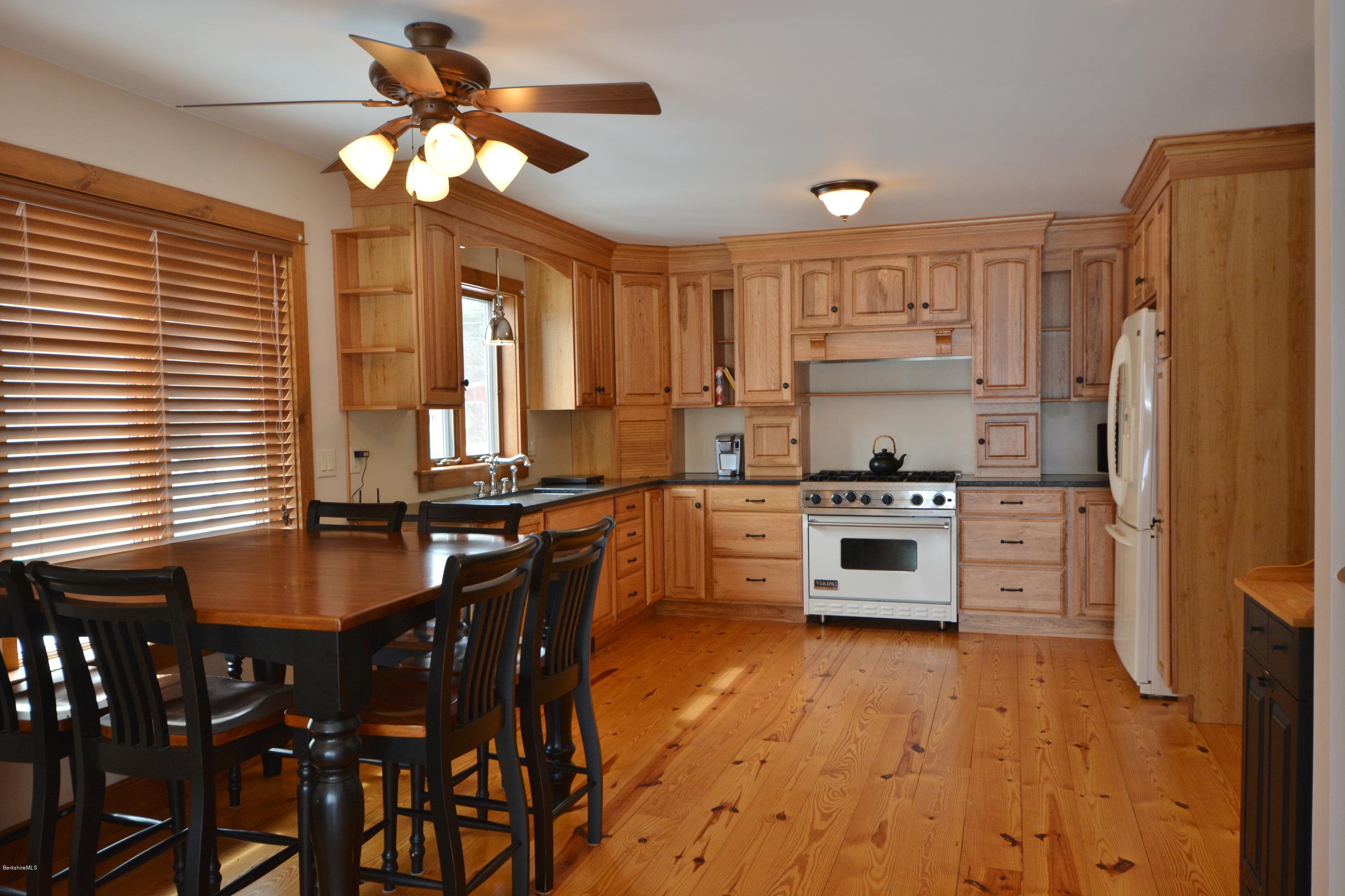 9 Old Stagecoach Road Otis, MA 01029 - Photo 5 of 17 a kitchen with granite countertop a sink appliances cabinets and furniture