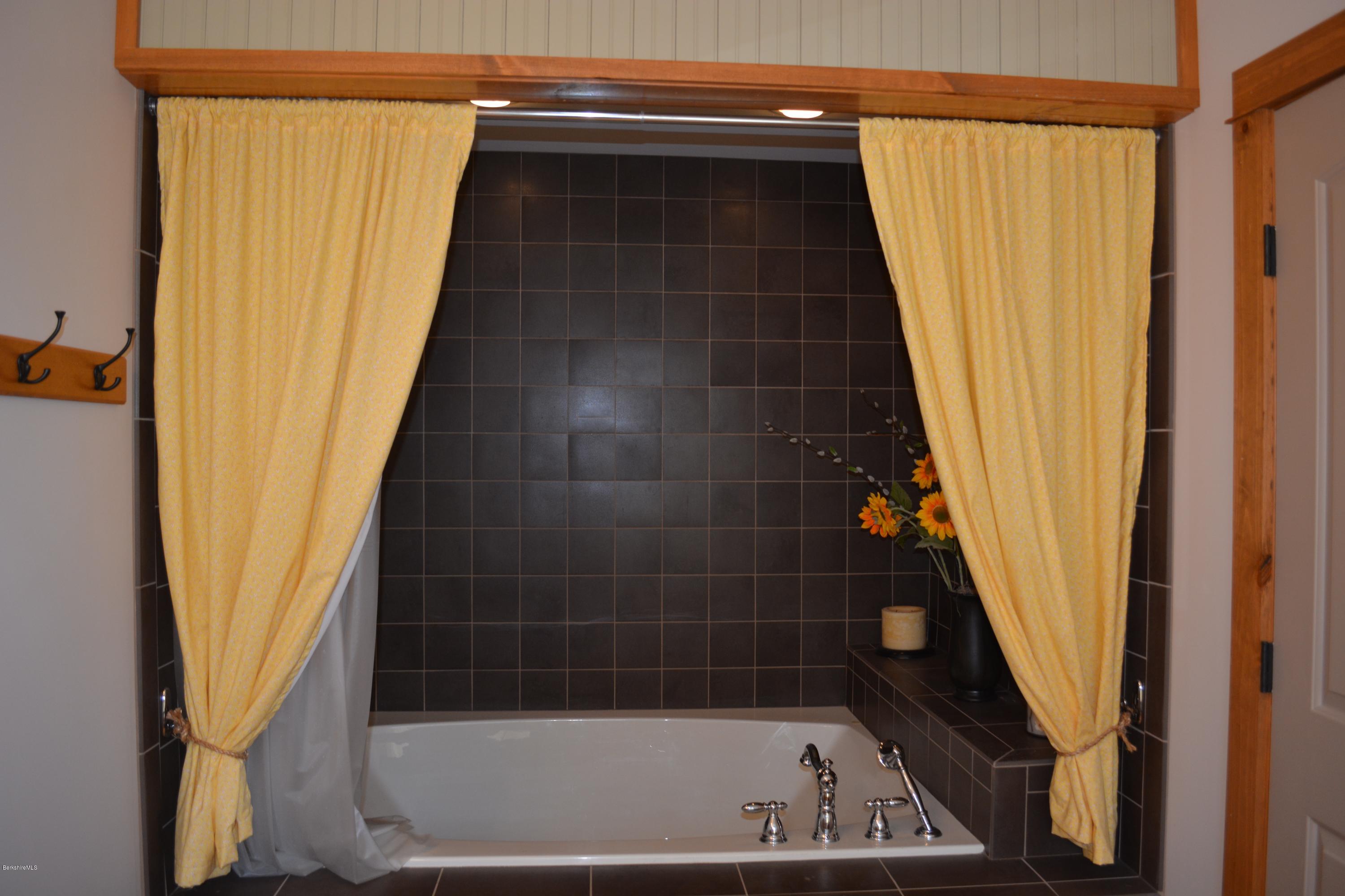 9 Old Stagecoach Road Otis, MA 01029 - Photo 10 of 17 a bathroom with a bathtub