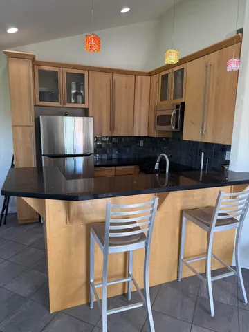 a kitchen with a sink cabinets and window