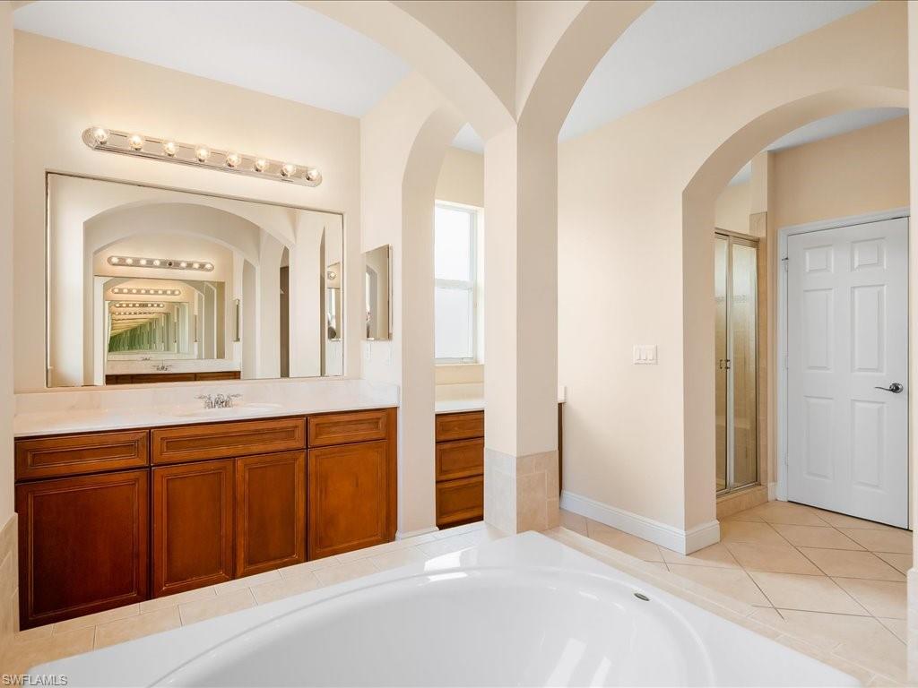 2055 Par Drive Naples, FL 34120 - Photo 12 of 32 a view of a hallway view with wooden floor and staircase