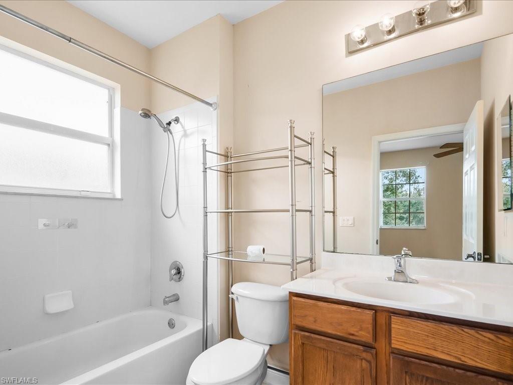 2055 Par Drive Naples, FL 34120 - Photo 17 of 32 a bathroom with a sink toilet vanity and tub