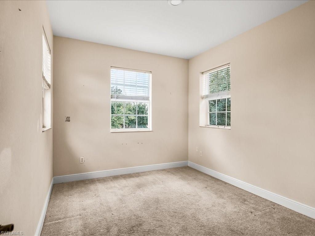 2055 Par Drive Naples, FL 34120 - Photo 20 of 32 an empty room with a window