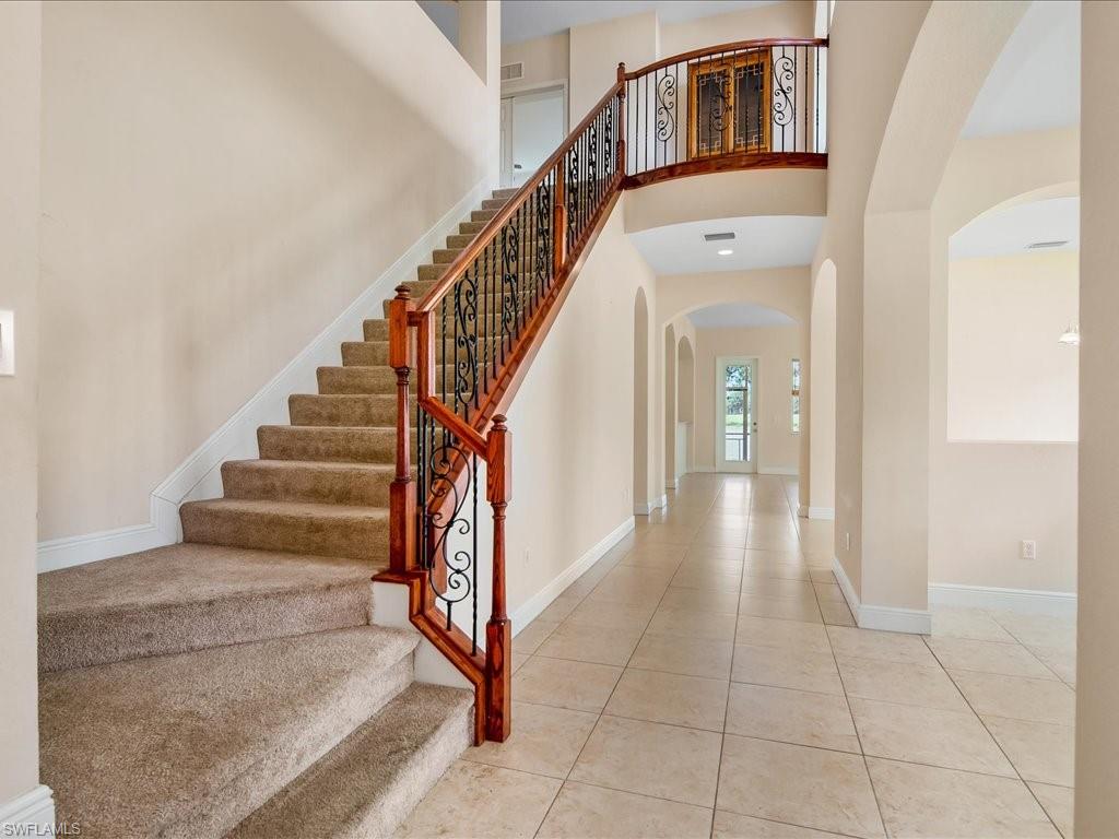 2055 Par Drive Naples, FL 34120 - Photo 2 of 32 a view of staircase with white walls and a window