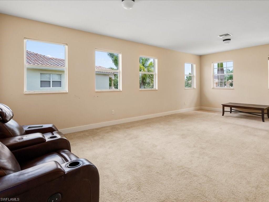 2055 Par Drive Naples, FL 34120 - Photo 23 of 32 a living room with furniture and a window