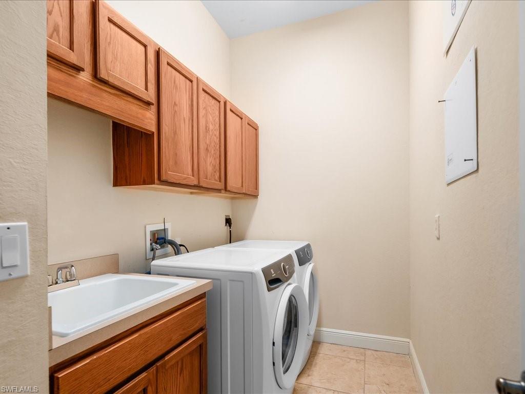 2055 Par Drive Naples, FL 34120 - Photo 25 of 32 a utility room with dryer and washer