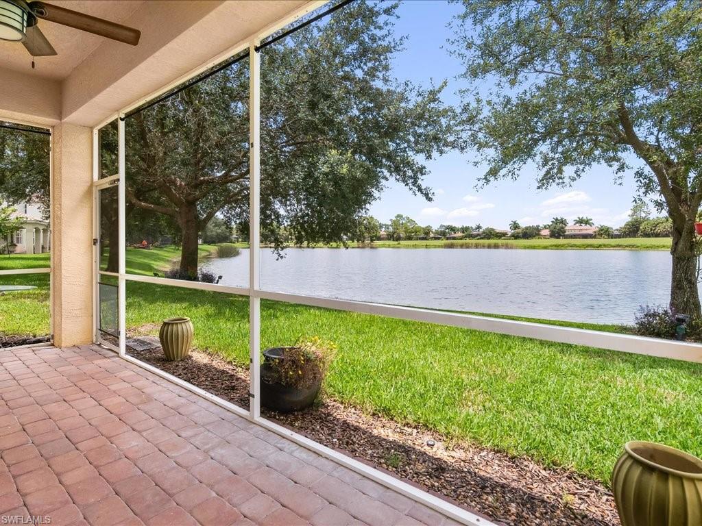 2055 Par Drive Naples, FL 34120 - Photo 26 of 32 a view of a backyard with mountain view and a lake view