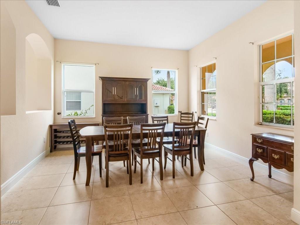2055 Par Drive Naples, FL 34120 - Photo 4 of 32 a view of a dining room with furniture and a window
