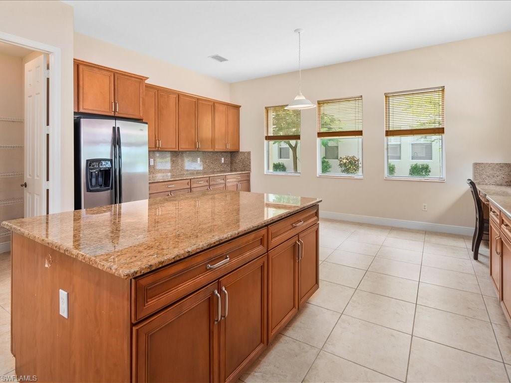 2055 Par Drive Naples, FL 34120 - Photo 6 of 32 a kitchen with stainless steel appliances granite countertop a sink and cabinets