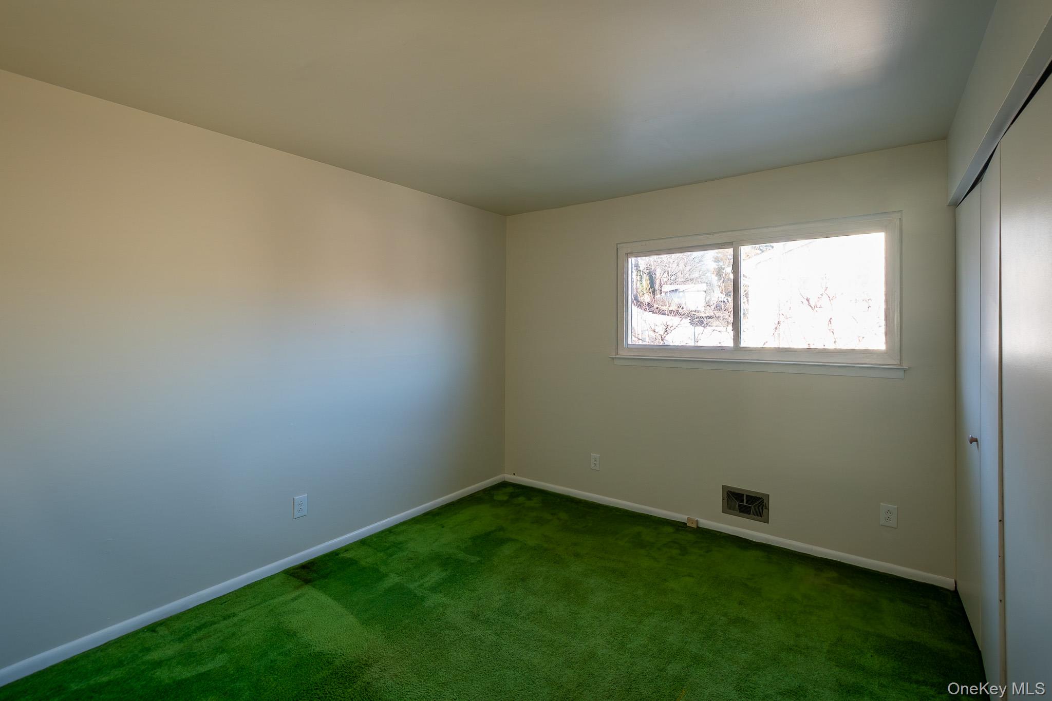 83 Edgepark Road White Plains, NY 10603 - Photo 20 of 25 an empty room with windows