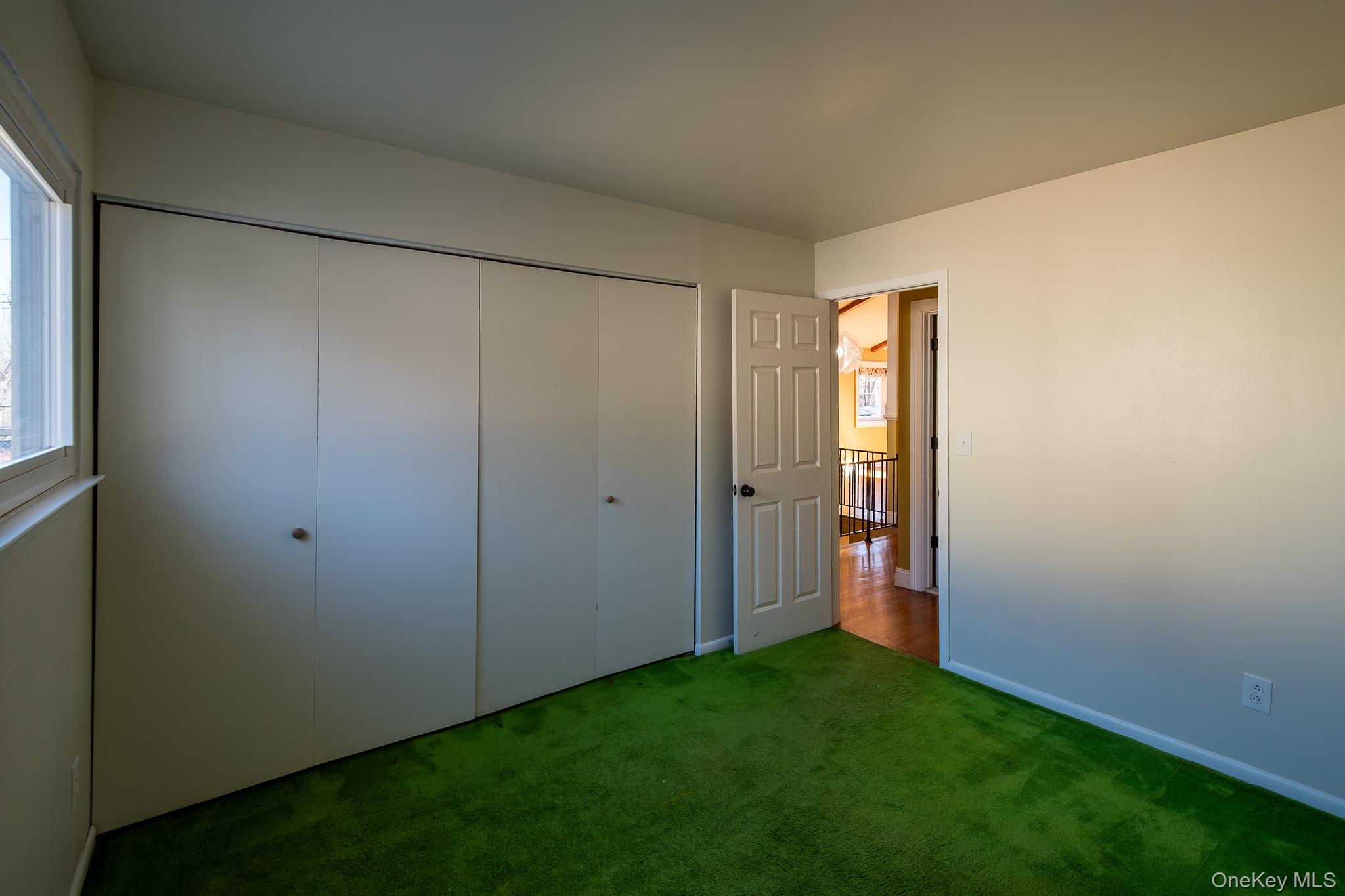 83 Edgepark Road White Plains, NY 10603 - Photo 21 of 25 a view of an empty room with closet and a window