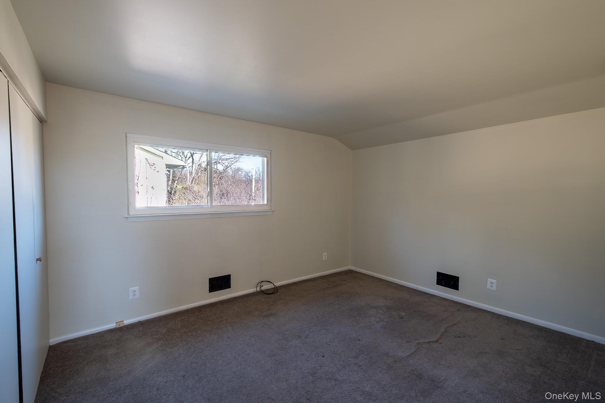 83 Edgepark Road White Plains, NY 10603 - Photo 22 of 25 an empty room with a window