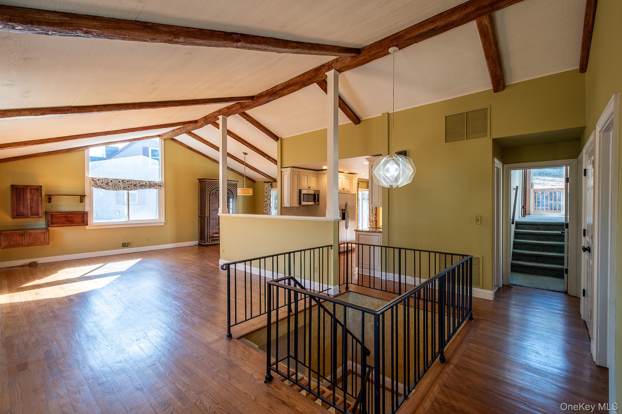 83 Edgepark Road White Plains, NY 10603 - Photo 3 of 25 a view of an entryway wooden floor and chandelier