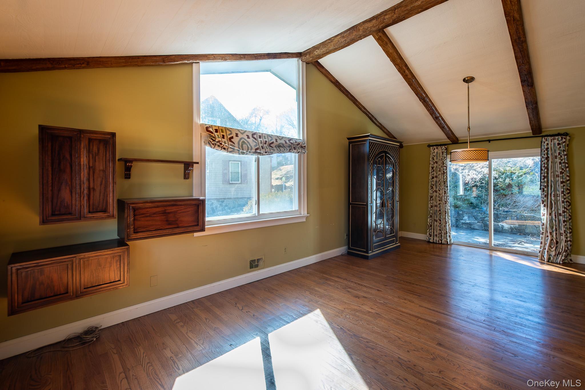 83 Edgepark Road White Plains, NY 10603 - Photo 4 of 25 a view of an empty room with wooden floor and a window