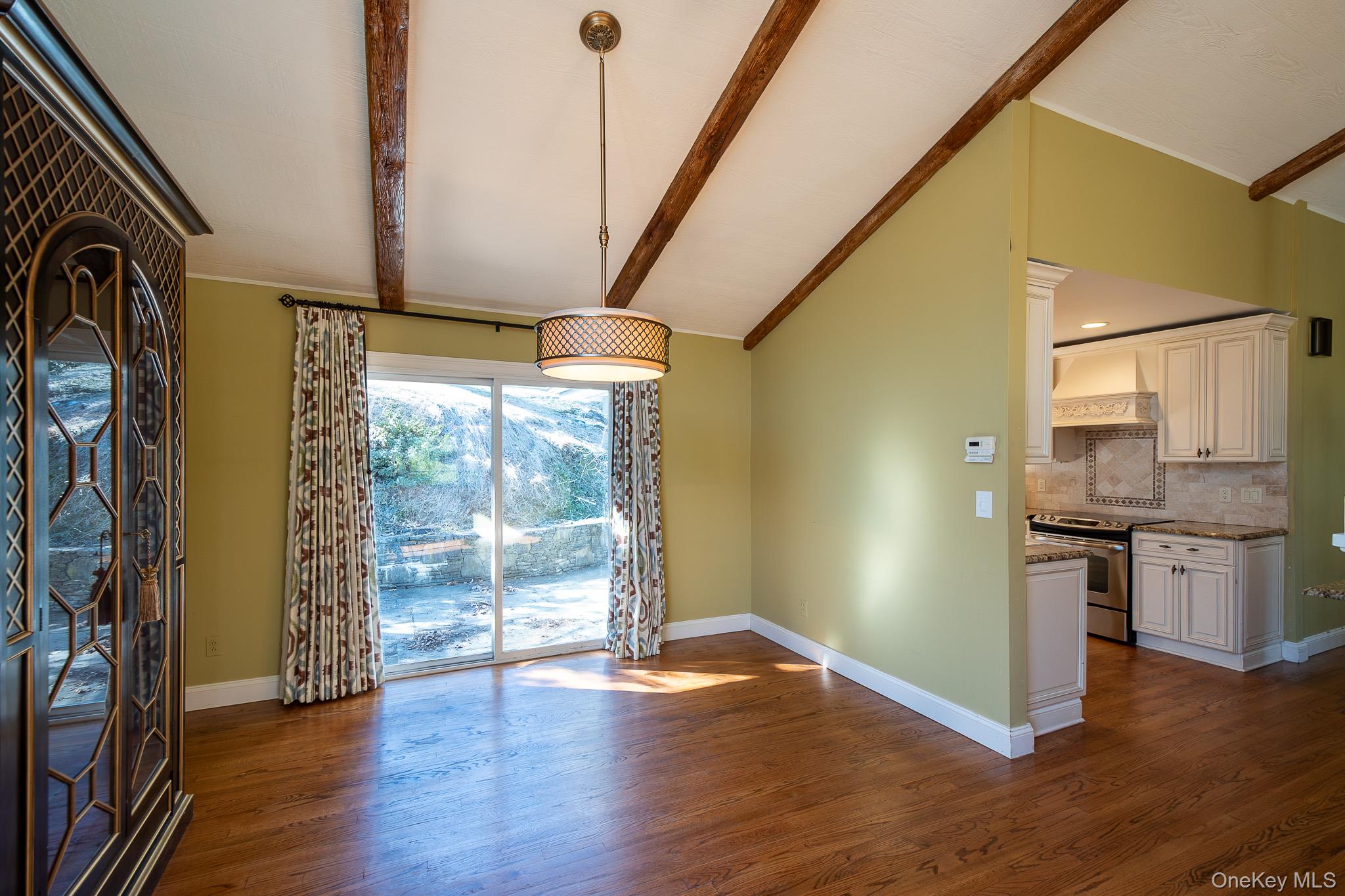 83 Edgepark Road White Plains, NY 10603 - Photo 5 of 25 a view of a kitchen with wooden floor and electronic appliances