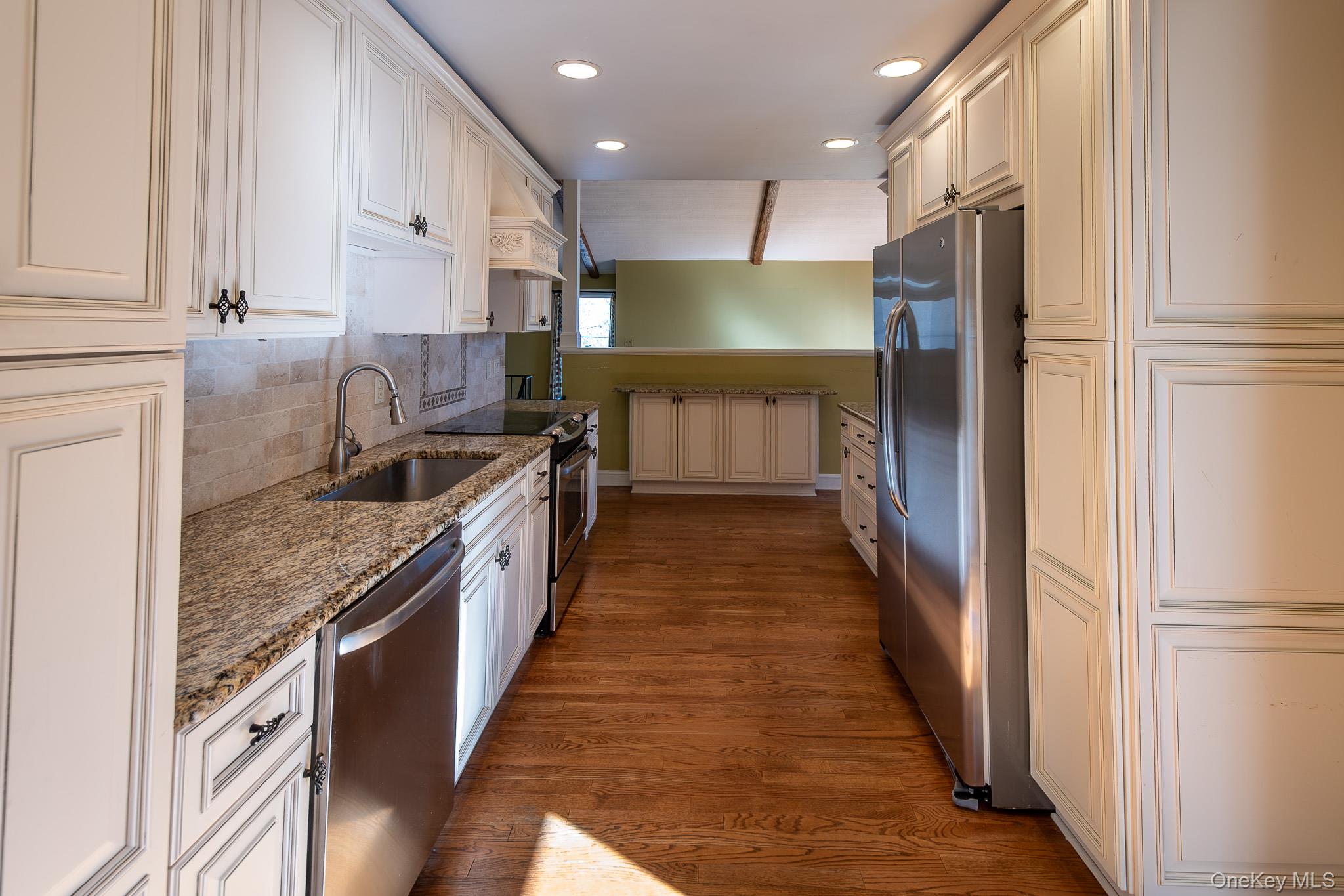 83 Edgepark Road White Plains, NY 10603 - Photo 6 of 25 a large kitchen with stainless steel appliances granite countertop a lot of counter space and a sink