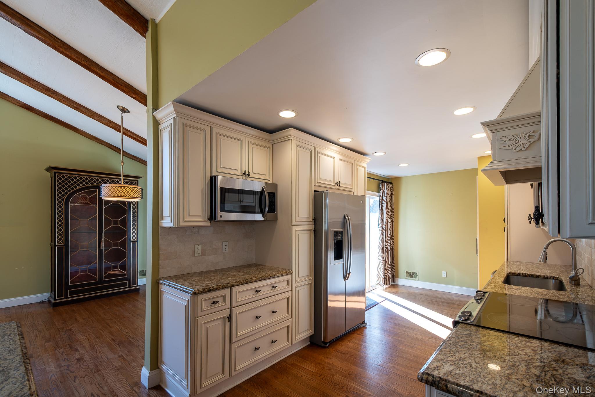 83 Edgepark Road White Plains, NY 10603 - Photo 7 of 25 a kitchen with stainless steel appliances granite countertop a refrigerator a stove and a sink
