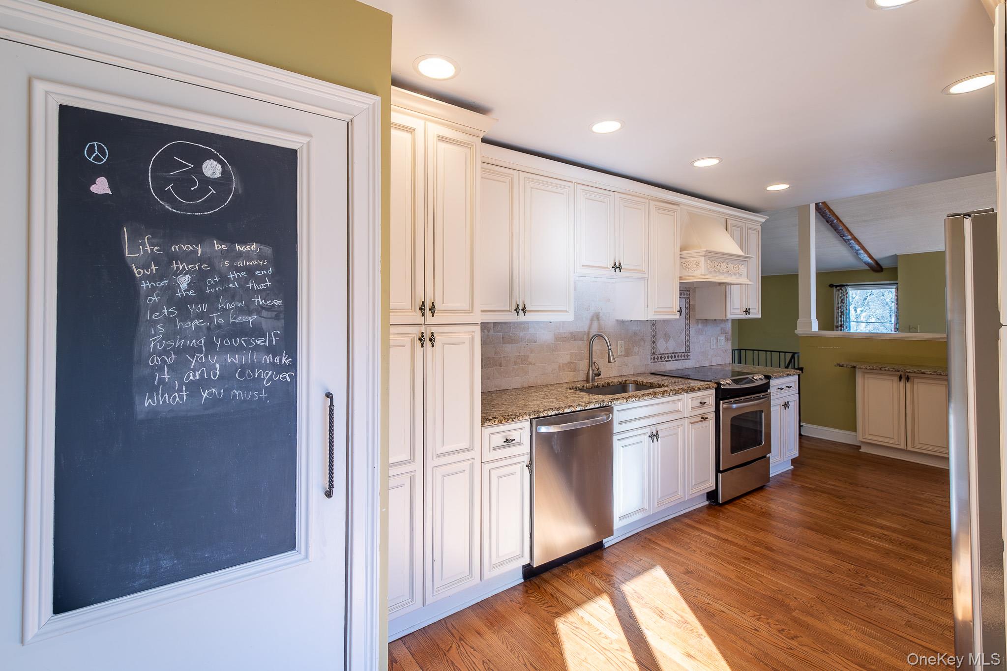 83 Edgepark Road White Plains, NY 10603 - Photo 9 of 25 a large kitchen with stainless steel appliances granite countertop a stove and a refrigerator