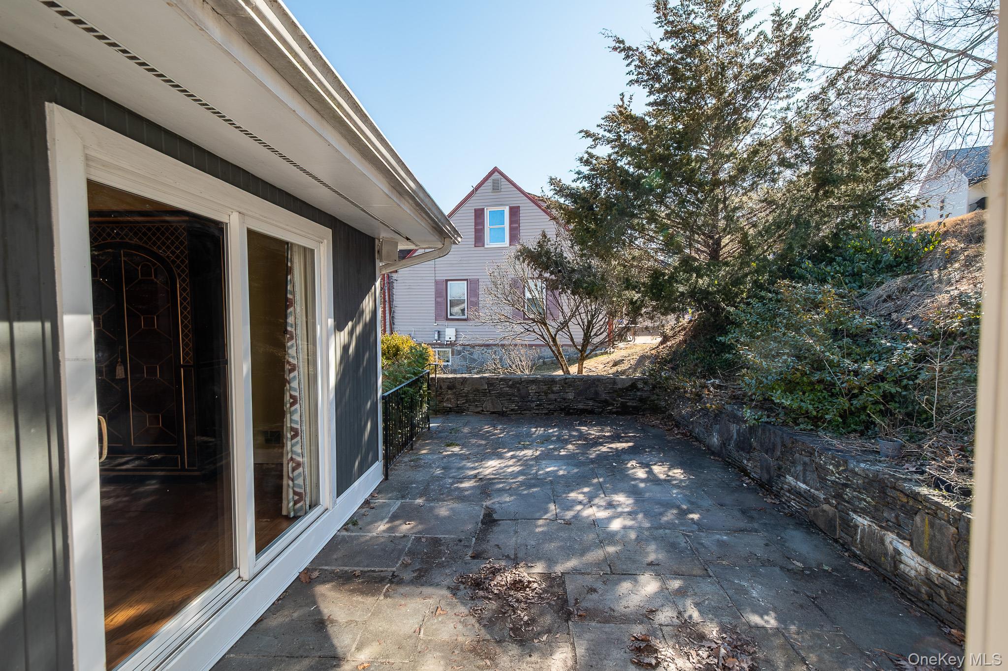 83 Edgepark Road White Plains, NY 10603 - Photo 10 of 25 a view of a house with a yard