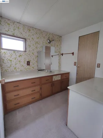 a room with a dresser and a mirror