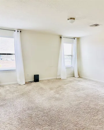 an empty room with windows