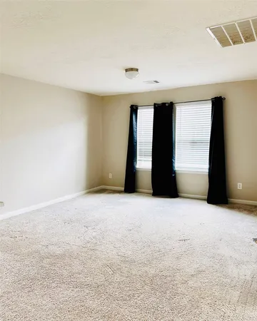 a view of empty room with windows