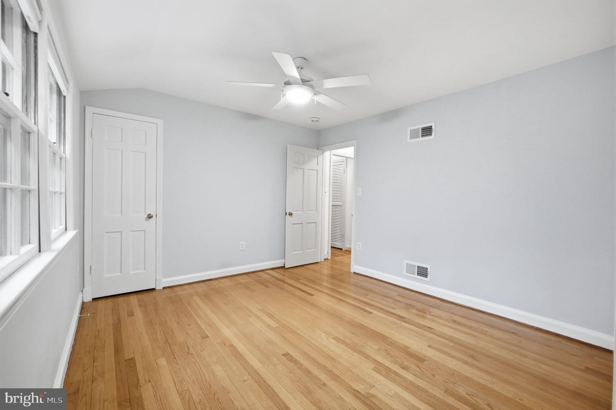 5910 Overlea Road Bethesda, MD 20816 - Photo 36 of 56 a view of an empty room with wooden floor