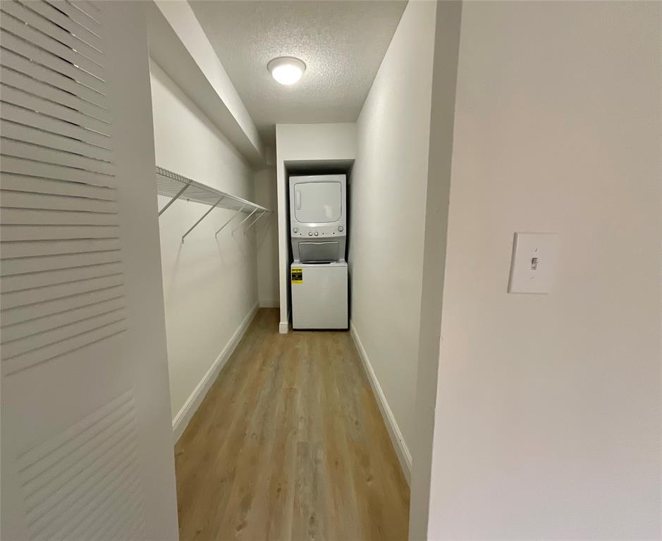 9517 Fontainebleau Boulevard, Unit 581315 Miami, FL 33172 - Photo 5 of 17 a view of a hallway with wooden floor and entryway