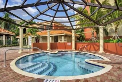 9517 Fontainebleau Boulevard, Unit 581315 Miami, FL 33172 - Photo 10 of 17 a view of a house with backyard and sitting area