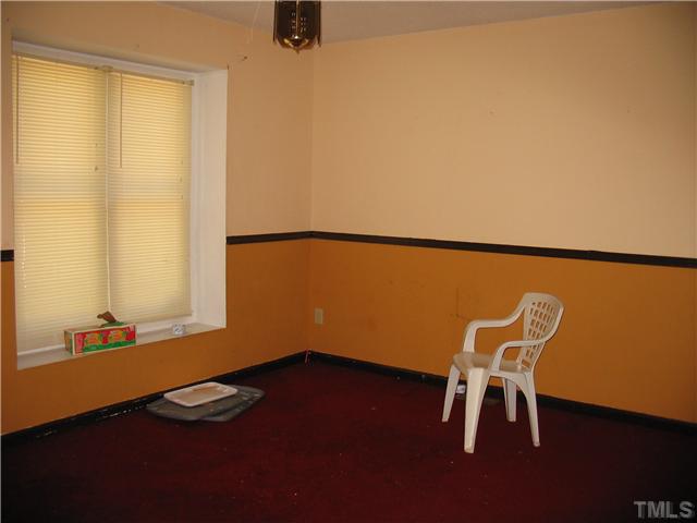 505 Ellis Court Raleigh, NC 27603 - Photo 3 of 12 a view of a room with a table and chairs