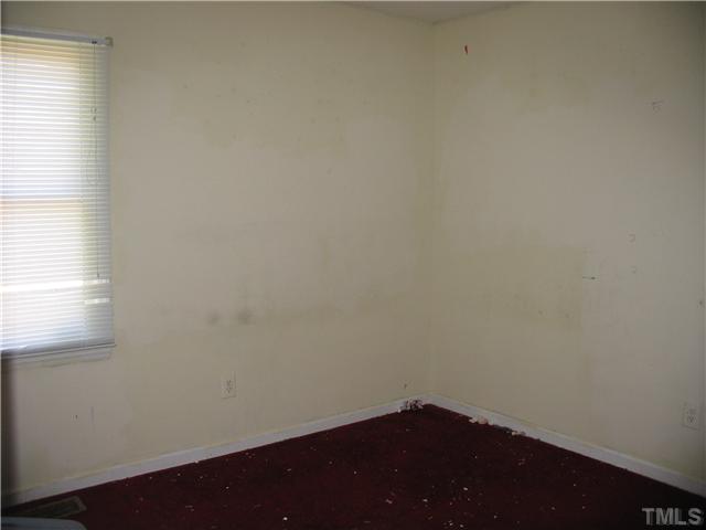 505 Ellis Court Raleigh, NC 27603 - Photo 8 of 12 an empty room with a window