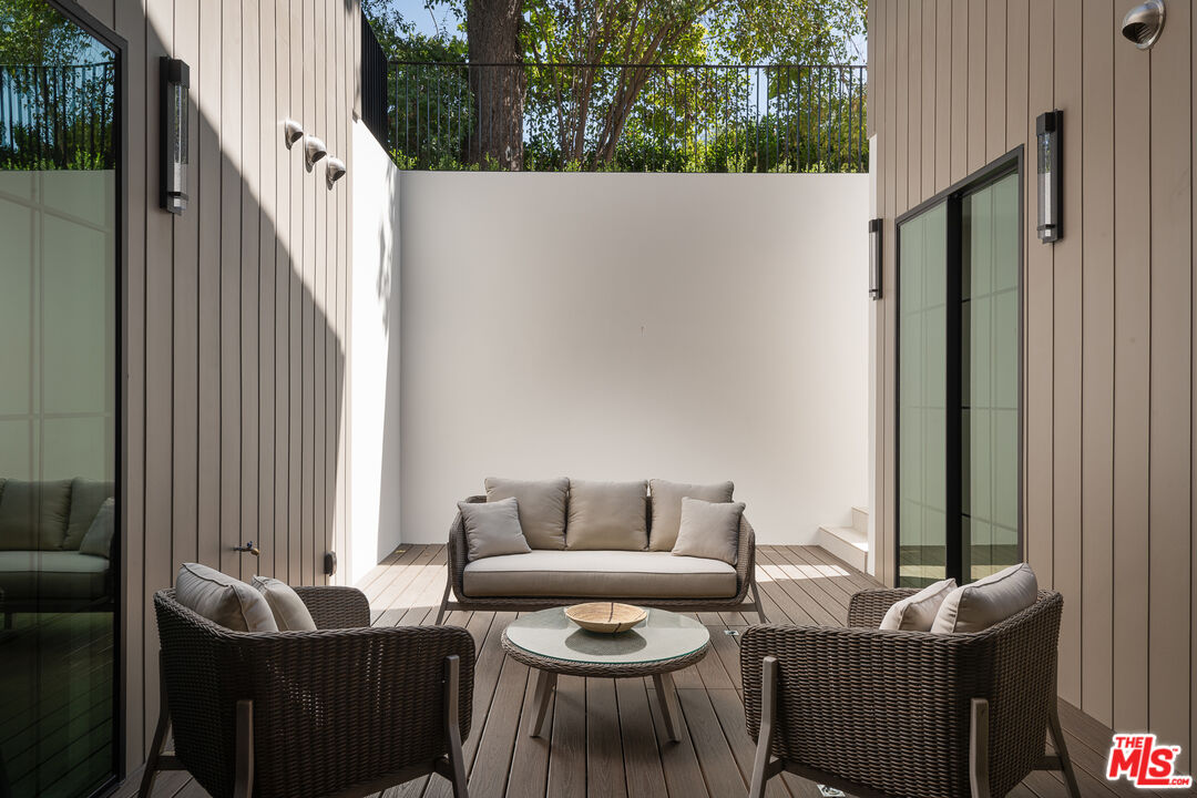 23615 Long Valley Road Hidden Hills, CA 91302 - Photo 58 of 75 a outdoor living room with furniture and a potted plant