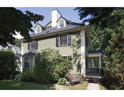 255 Clinton Road Brookline, MA 02445 - Photo 1 of 13 a view of a house with a large windows and flower plants