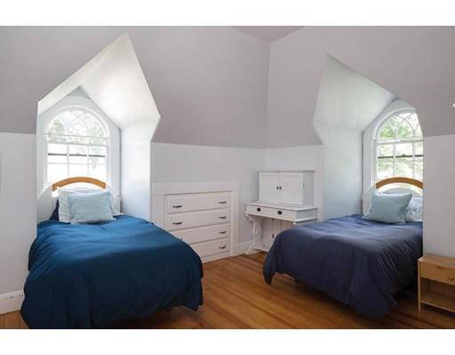 255 Clinton Road Brookline, MA 02445 - Photo 11 of 13 a bedroom with a bed and window