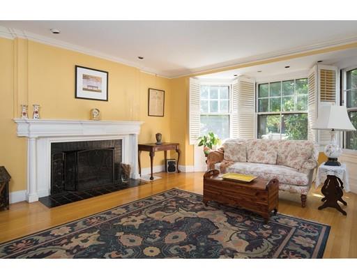 255 Clinton Road Brookline, MA 02445 - Photo 3 of 13 a living room with furniture and a fireplace