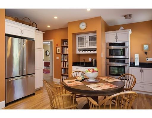 255 Clinton Road Brookline, MA 02445 - Photo 7 of 13 a view of a dining room with furniture and wooden floor