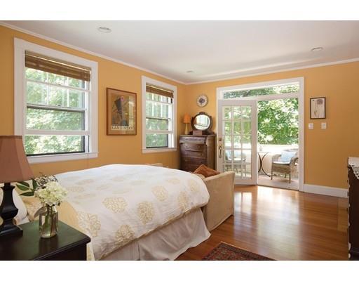 255 Clinton Road Brookline, MA 02445 - Photo 9 of 13 a bedroom with a balcony a bed and glass door