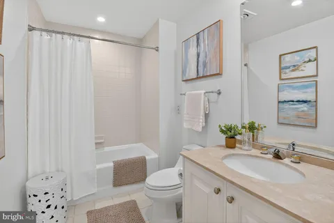 a living room with furniture and a lamp