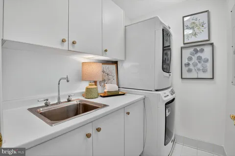 a balcony with wooden floor and outdoor seating