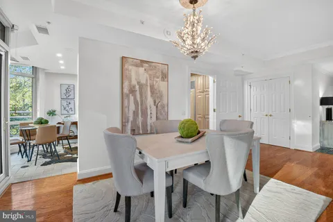 a view of a dining room with furniture and wooden floor