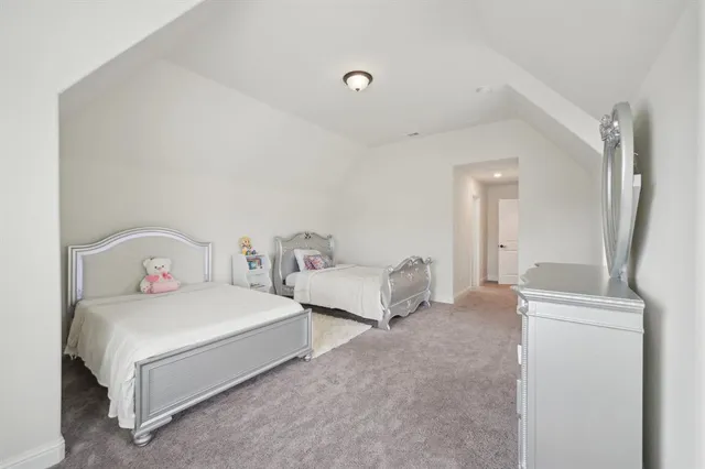 a bedroom with a bed and a cabinets