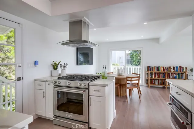 a kitchen with a stove and cabinets