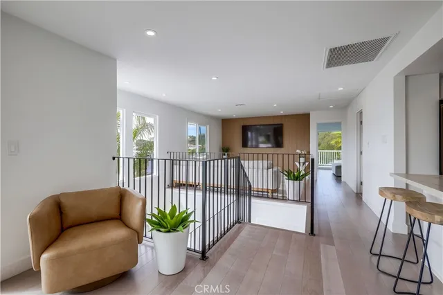 a lobby with furniture and a potted plant