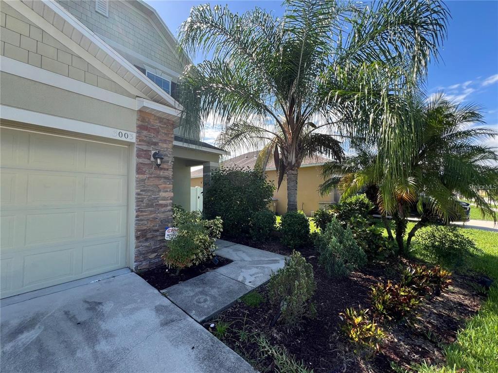 3003 Cobham Road Kissimmee, FL 34758 - Photo 2 of 43 a view of a house with a garden