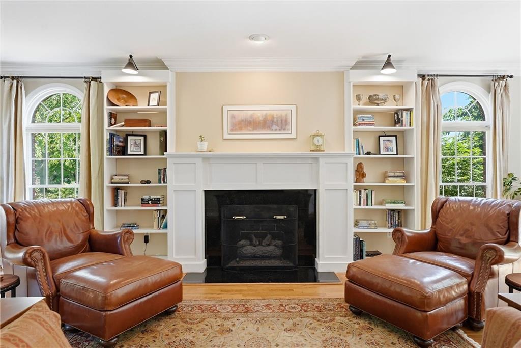 900 Settlers Ridge Road Pittsburgh, PA 15238 - Photo 7 of 50 The living room features a gas fireplace framed by custom built-ins.
