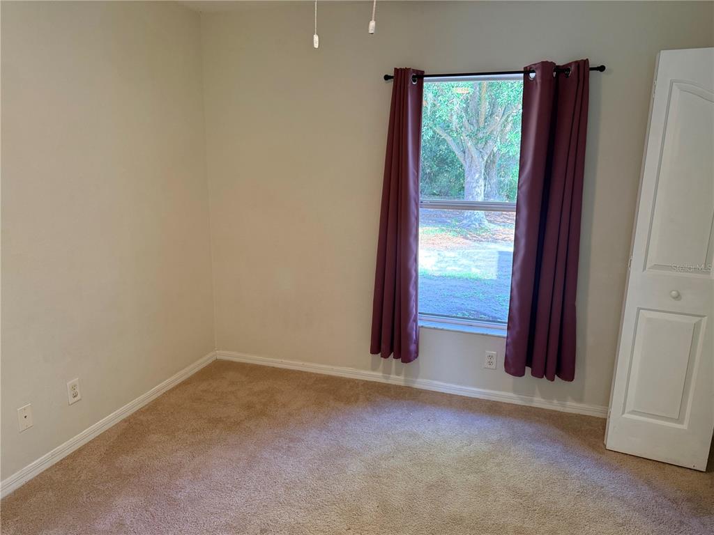 4185 Amari Road North Port, FL 34291 - Photo 8 of 14 a view of an empty room with a window