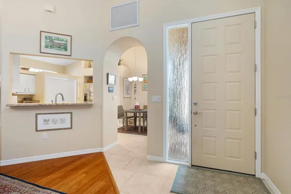 a kitchen with a refrigerator and microwave